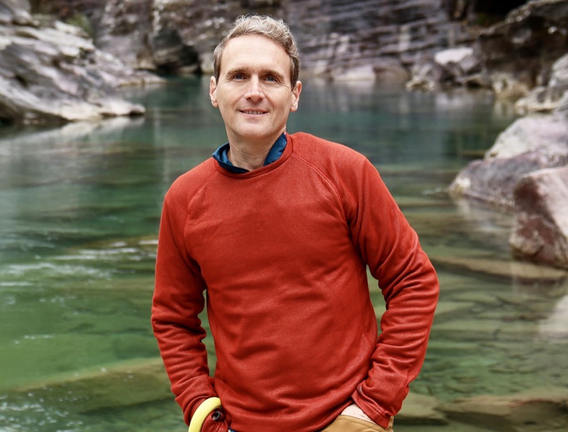 Daniel Branco — outdoor portrait by an emerald river